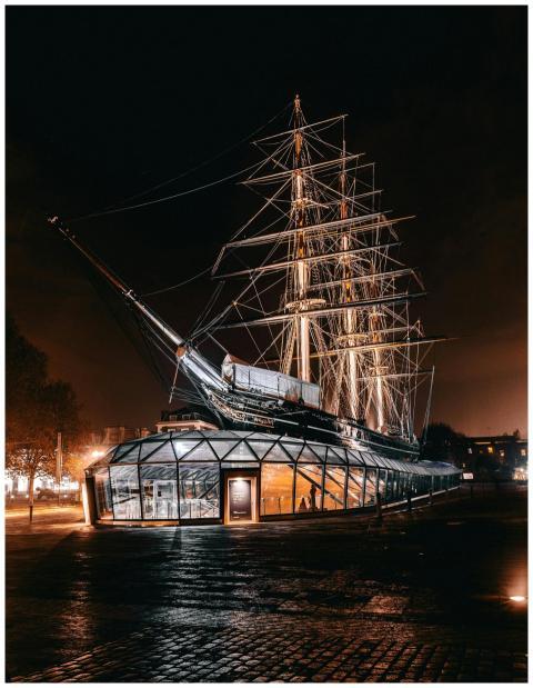 Night view of the iconic Cutty Sark ship in London