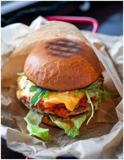 Close-up of a mouthwatering cheeseburger with fres