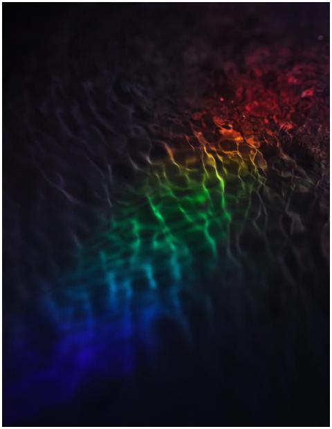 Vibrant rainbow light reflections creating an abst