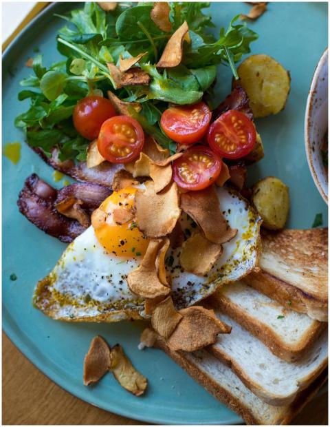 Delicious breakfast with egg, bacon, tomatoes, sal