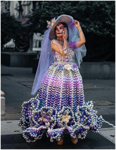 Colorful Day of the Dead costume on a woman outdoo