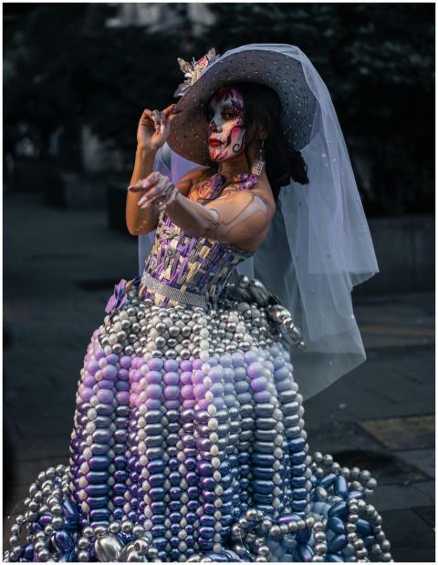 Woman wearing a colorful balloon dress and Dia de