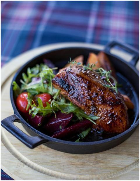 Delicious grilled meat served with salad and veget