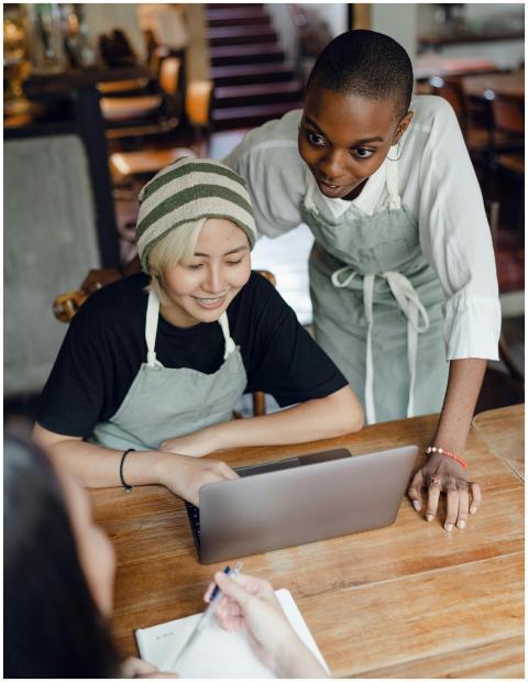 From above of optimistic diverse female workers of