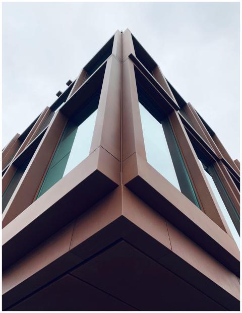 Low-angle view of a modern building with angular d