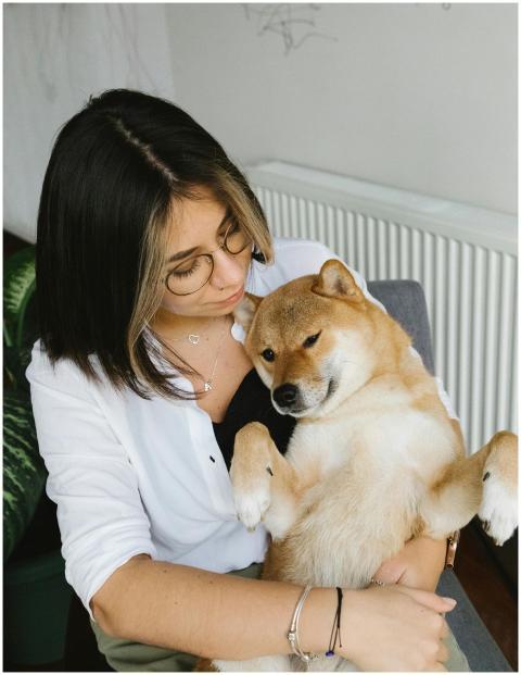 From above content female in casual clothes huggin