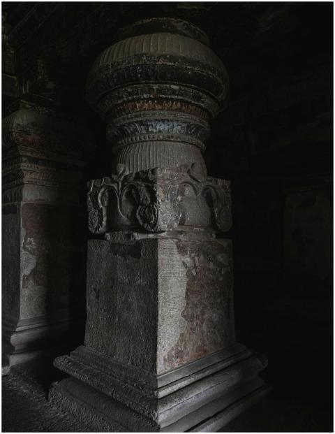 A detailed view of an ancient stone pillar inside