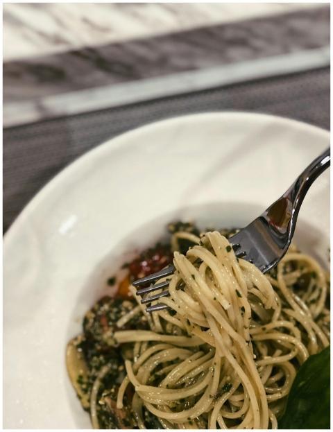 Savor a forkful of flavorful spaghetti with herbs,