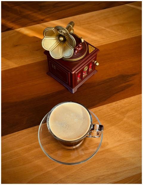 Cozy scene with a vintage gramophone and coffee cu