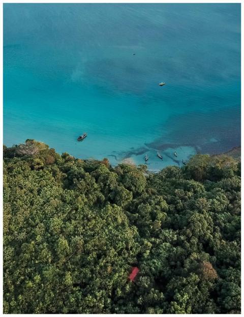 Aerial shot capturing the turquoise waters and lus