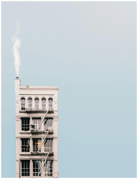 A minimalist photo of a high-rise building with sm