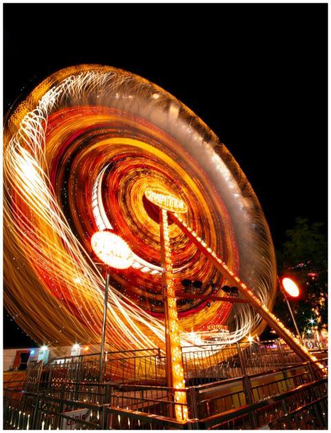 Vibrant long-exposure photo of an illuminated caro