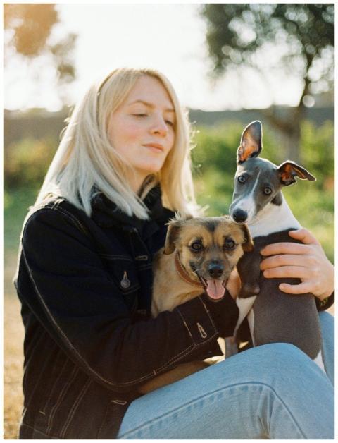 A young woman enjoying a day outdoors with her two