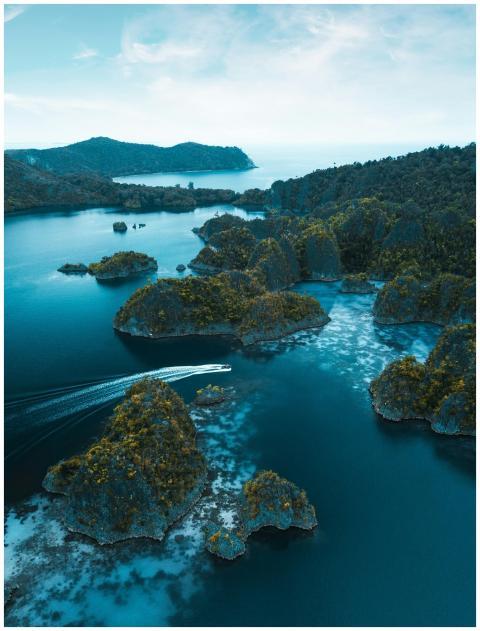 Stunning aerial view of Raja Ampat's blue waters a
