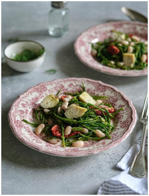 Delicious vegan salad with artichokes, beans, and