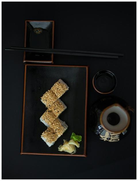 Beautifully arranged sushi with soy sauce and chop