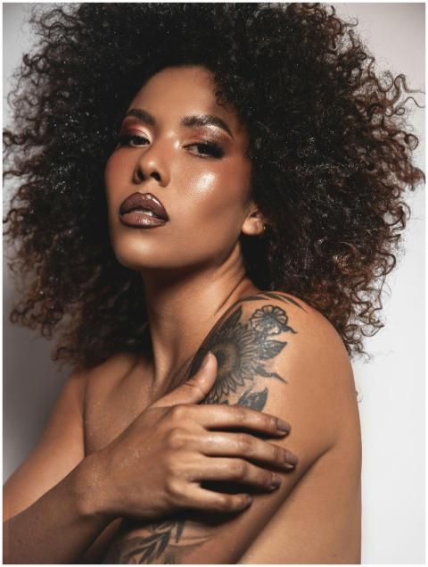 Stunning portrait of an elegant woman with curly h