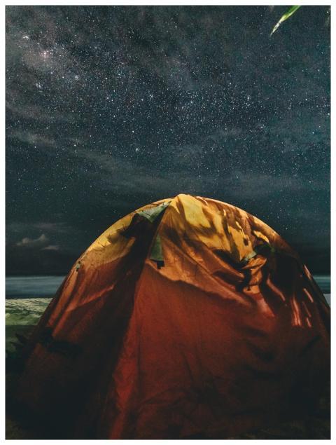 Experience the serenity of camping beneath a stunn