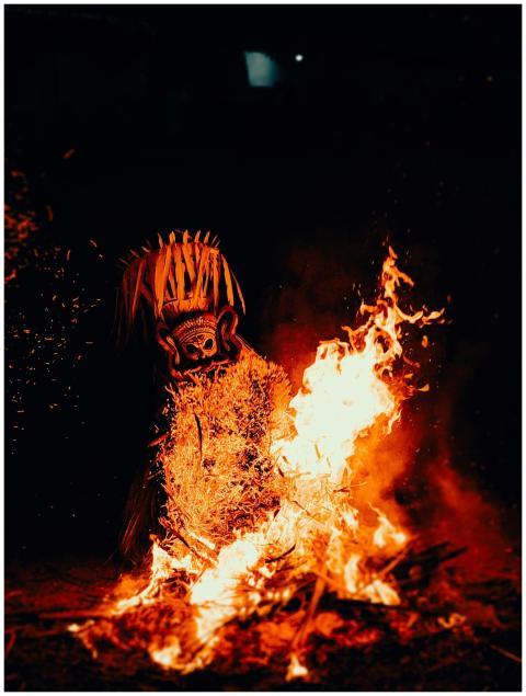 Vibrant night scene of a traditional fire dance ri