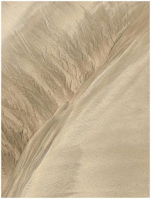 As the tide recedes, wondrous sandy deposits emerg