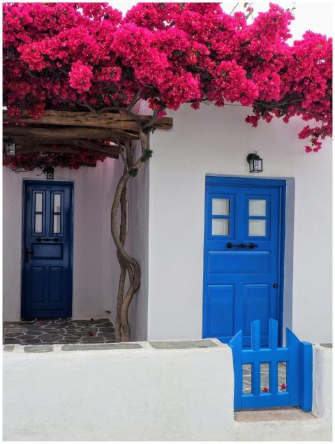 Charming Mediterranean white house with blue woode