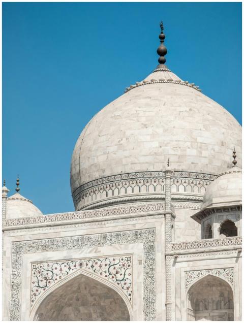 Close-up of the Taj Mahal's dome and facade under