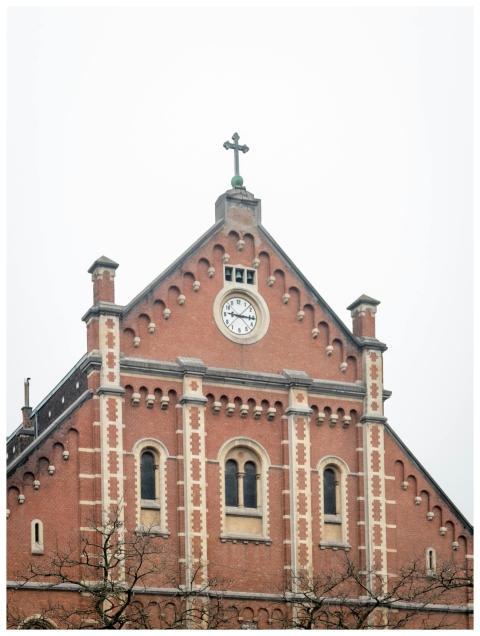 A striking view of a historic brick church with cl