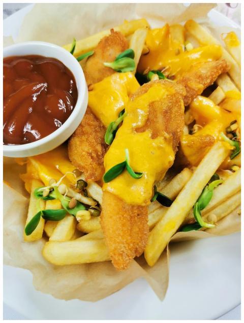 Scrumptious fried fish served with golden cheese f