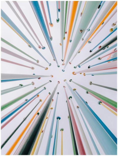 A vibrant array of vertical poles creates a fascin