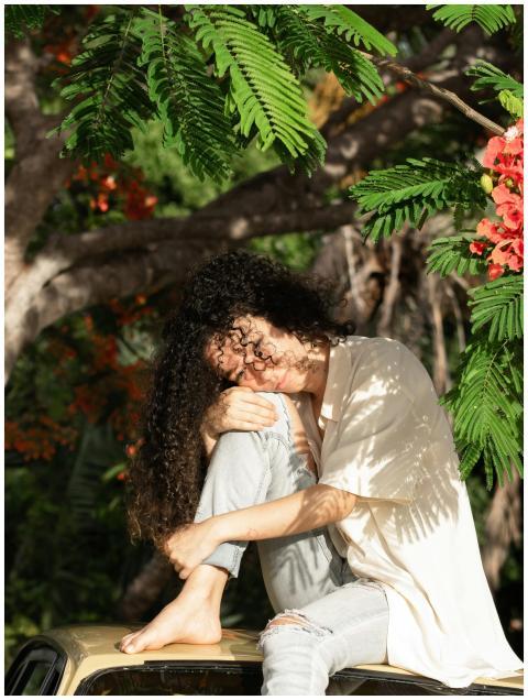 Relaxing outdoors among tropical greenery, a woman