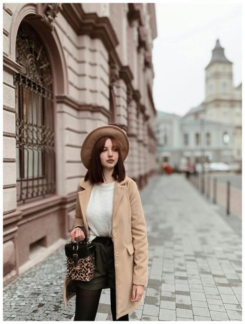 Fashionable woman wearing a hat and coat strolling