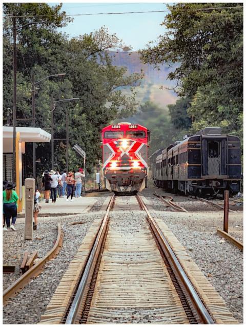 Colorful train arriving at Tequila, Mexico station