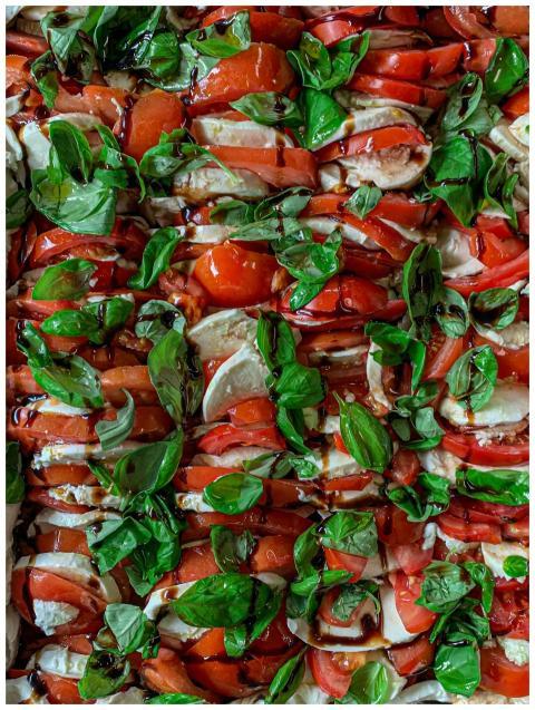 Mouthwatering Caprese salad with ripe tomatoes, ba