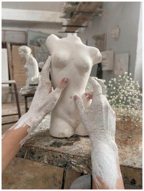 Unrecognizable talented artisan with dirty hands m