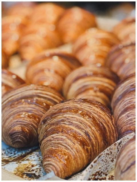 Golden croissants displayed at a bakery in Berlin,