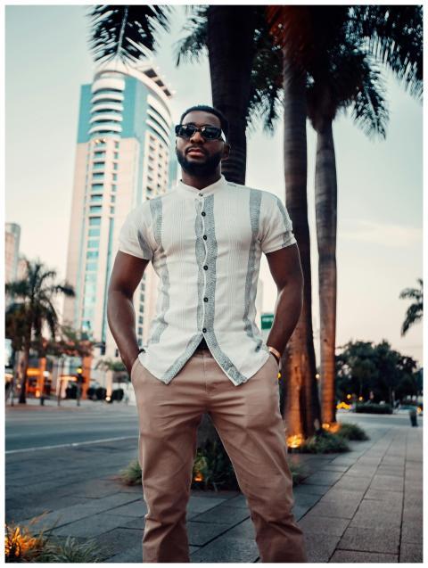 Fashionable adult man with sunglasses standing in