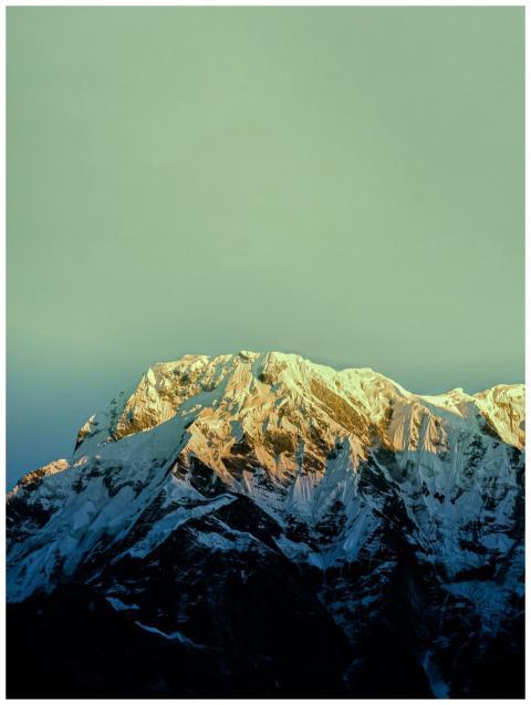 Stunning view of a snow-covered mountain peak illu