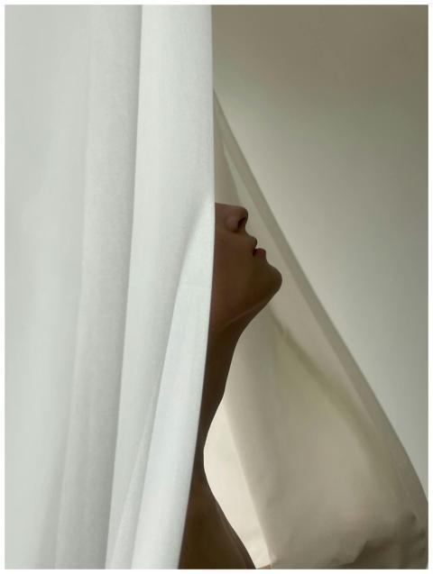 Intriguing profile of a woman partially hidden by