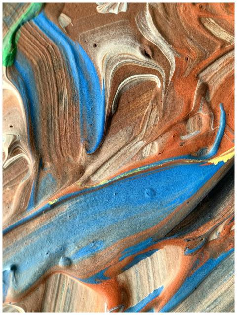 Vibrant abstract swirls of acrylic paint create a