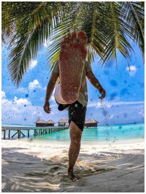 Casual beach day in the Maldives with a playful ki