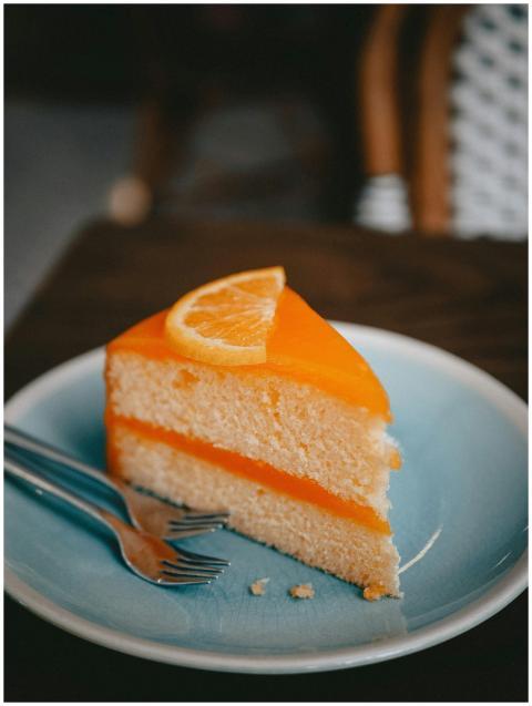 Close-up of a tempting orange cake slice served on