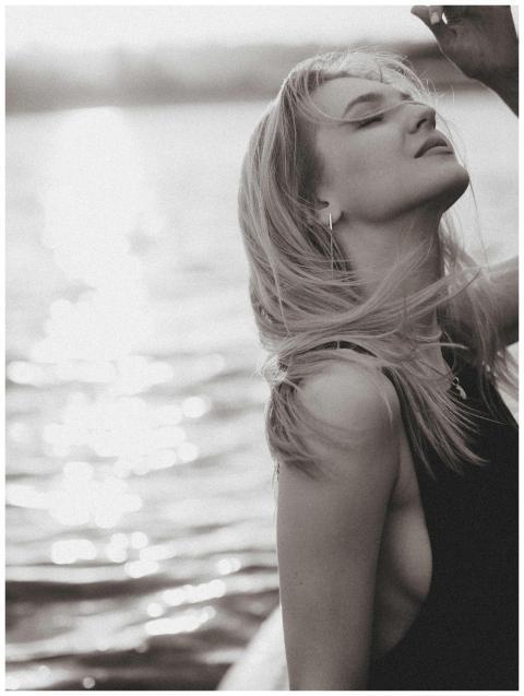 Black and white portrait of a young woman enjoying