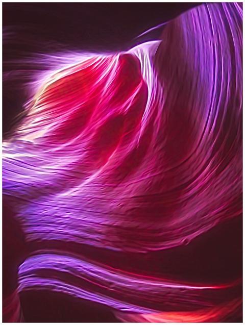 Abstract image of vibrant flowing light trails in
