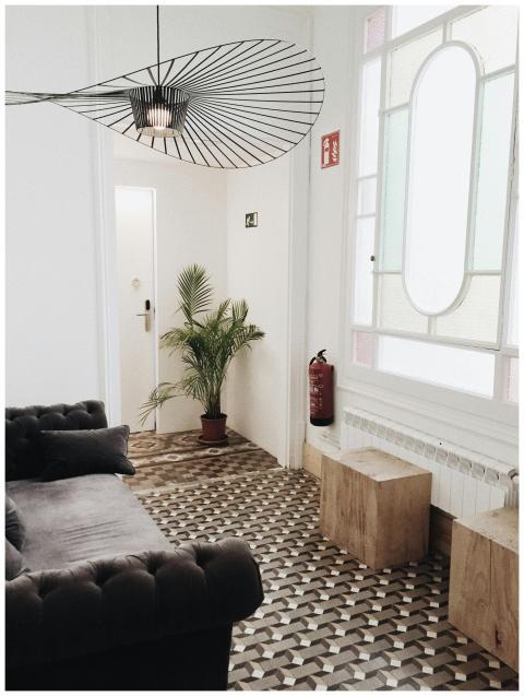 Elegant living room with geometric flooring, plush