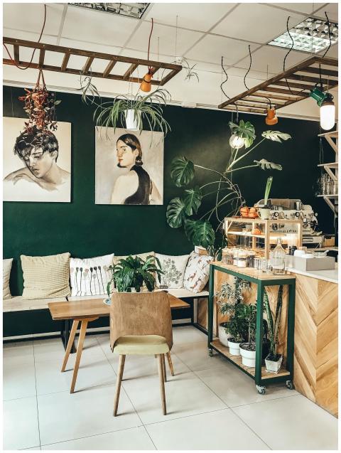 Stylish café interior featuring modern décor, gree
