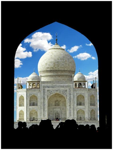 Stunning view of the iconic Taj Mahal against a bl
