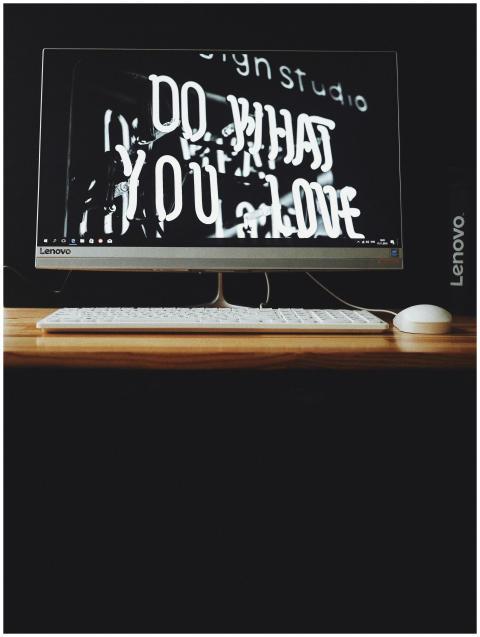 Lenovo desktop with keyboard and monitor displayin