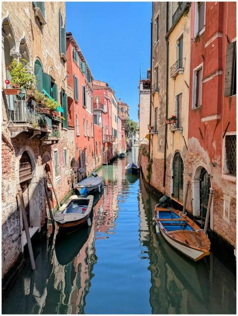 Charming Venetian canal with colorful facades and