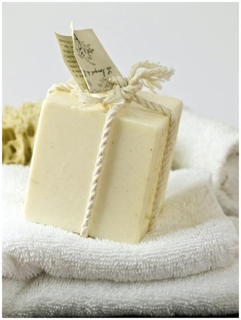 A close-up of handmade soap wrapped with natural r