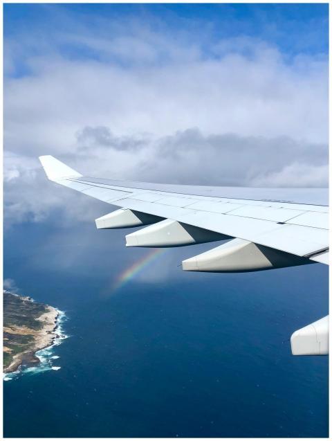 A scenic aerial view of an airplane wing over the